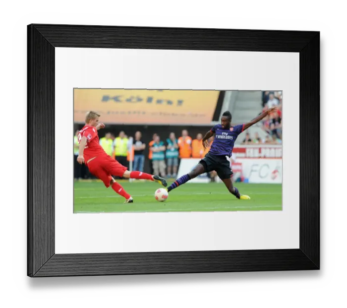 Framed Print : Johan Djourou (Arsenal) Kacper Przybylko (Cologne). Cologne 0: 4 Arsenal