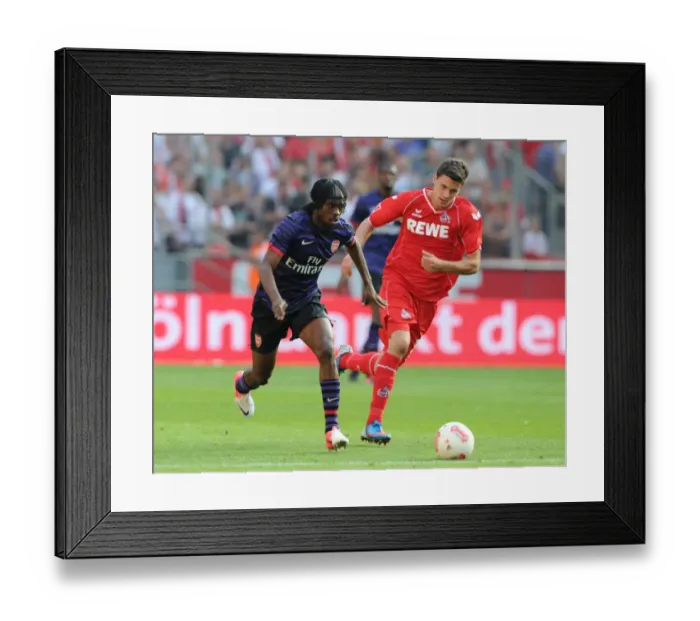 Framed Print : Gervinho (Arsenal) Tobias Strobl (Cologne). Cologne 0: 4 Arsenal. Pre Season Friendly
