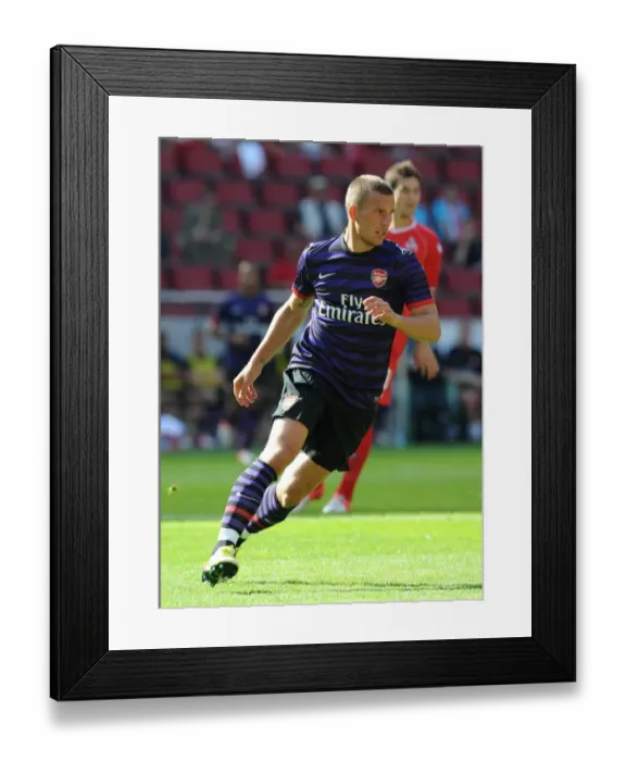 Framed Print : Lukas Podolski (Arsenal). Cologne 0: 4 Arsenal. Pre Season Friendly. Rhein Energie Stadium Framed Print : Lukas Podolski (Arsenal). Cologne 0: 4 Arsenal. Pre Season Friendly. Rhein Energie Stadium