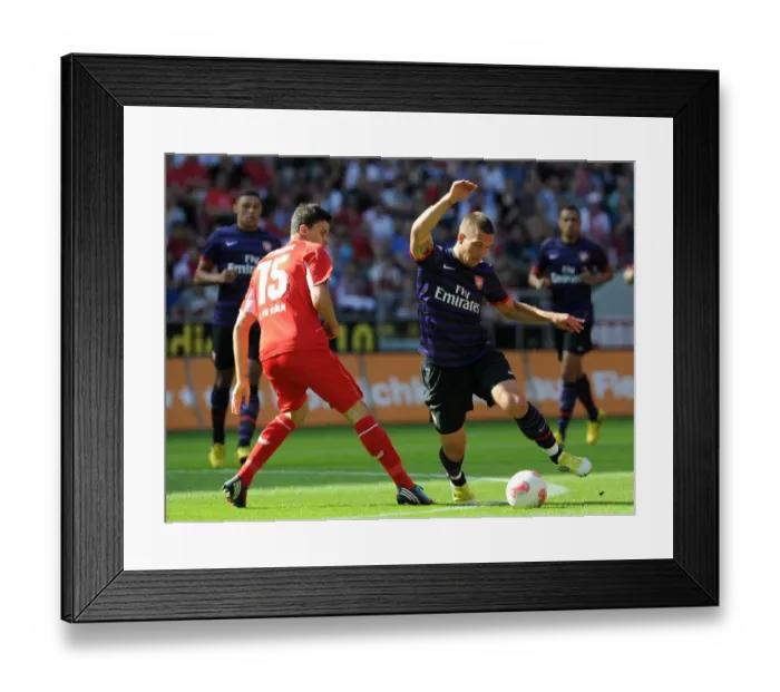 Framed Print : Lukas Podolski (Arsenal) Tobias Strobl (Cologne). Cologne 0: 4 Arsenal. Pre Season Friendly Framed Print : Lukas Podolski (Arsenal) Tobias Strobl (Cologne). Cologne 0: 4 Arsenal. Pre Season Friendly