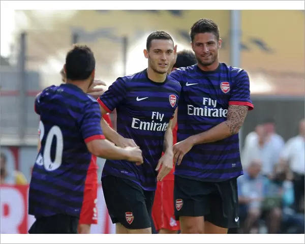 Thomas Vermaelen celebrates scoring Arsenals 1st goal with Santi Cazorla and Olivier Giroud
