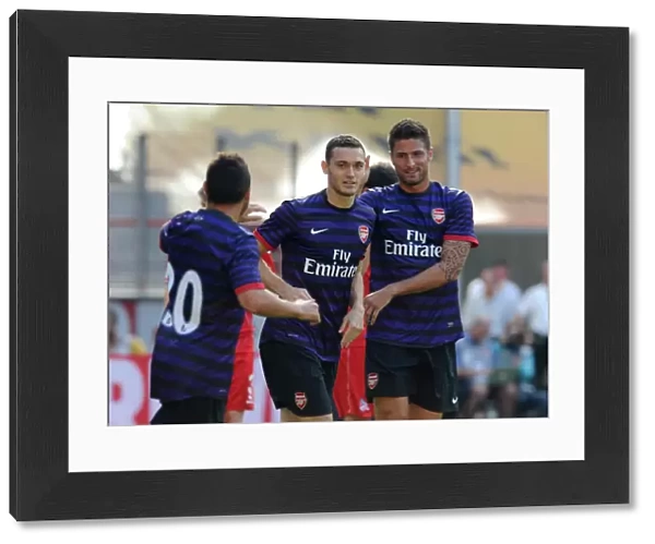Thomas Vermaelen celebrates scoring Arsenals 1st goal with Santi Cazorla and Olivier Giroud