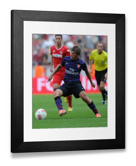 Framed Print : Andrey Arshavin in Action: Arsenal vs. FC Cologne Pre-Season Friendly (2012) Framed Print : Andrey Arshavin in Action: Arsenal vs. FC Cologne Pre-Season Friendly (2012)