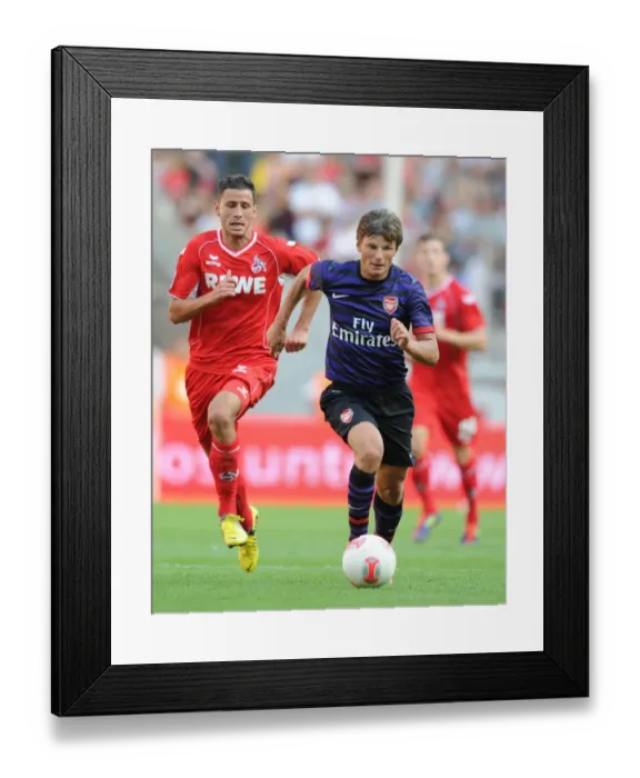 Framed Print : Arshavin Clashes with Cologne: Pre-Season Friendly Showdown Framed Print : Arshavin Clashes with Cologne: Pre-Season Friendly Showdown