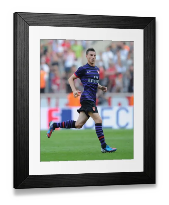 Framed Print : Laurent Koscielny Faces Off Against FC Cologne in 2012 Pre-Season Friendly