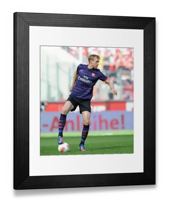Framed Print : Arsenal's Per Mertesacker Faces Off Against FC Cologne in 2012 Pre-Season Friendly