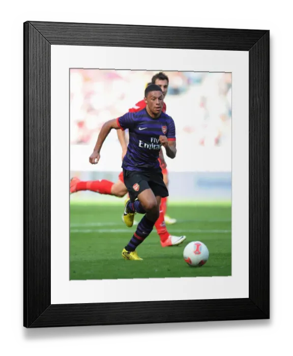 Framed Print : Arsenal's Alex Oxlade-Chamberlain Faces Off Against FC Cologne in 2012 Pre-Season Friendly