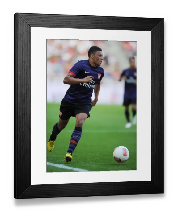 Framed Print : Arsenal's Alex Oxlade-Chamberlain Goes Head-to-Head with FC Cologne in 2012 Pre-Season Clash