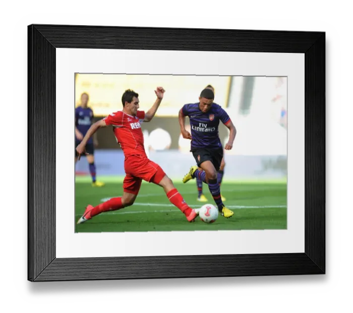 Framed Print : Arsenal's Oxlade-Chamberlain Faces Off Against Cologne's Jajalo in 2012 Pre-Season Clash Framed Print : Arsenal's Oxlade-Chamberlain Faces Off Against Cologne's Jajalo in 2012 Pre-Season Clash
