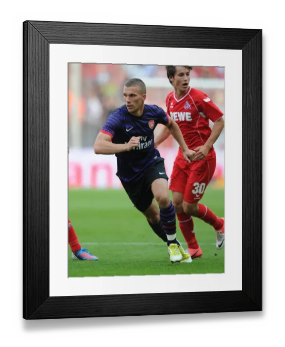 Framed Print : Lukas Podolski Clashes with Former Team: Cologne vs Arsenal, 2012-13 Pre-Season Friendly Framed Print : Lukas Podolski Clashes with Former Team: Cologne vs Arsenal, 2012-13 Pre-Season Friendly