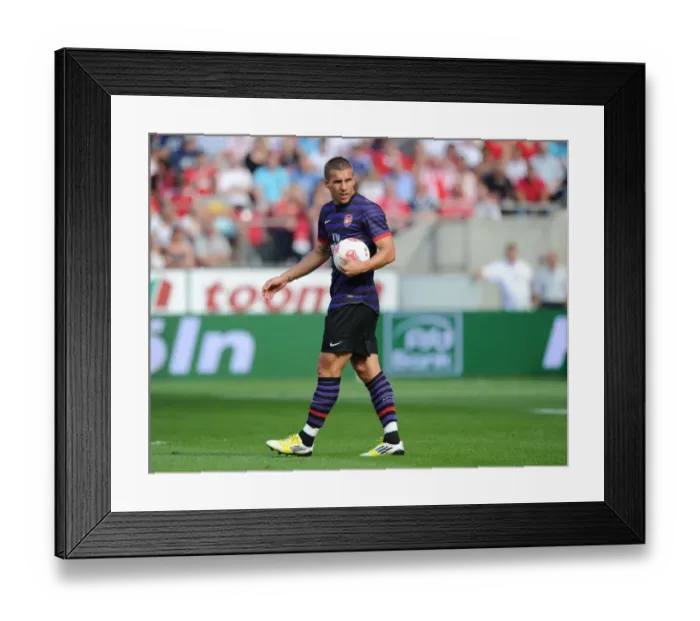 Framed Print : Arsenal's Podolski in Action: Cologne Pre-Season Clash, 2012