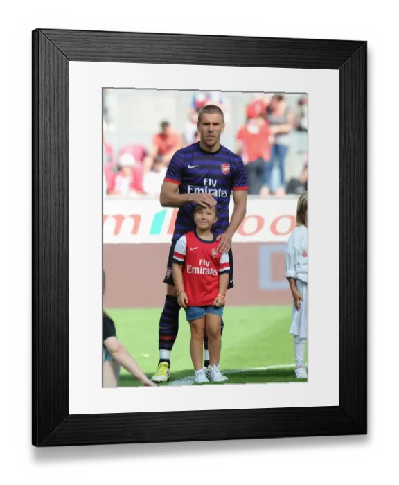 Framed Print : Lukas Podolski: Arsenal Star Prepares for Cologne Clash (2012-13)