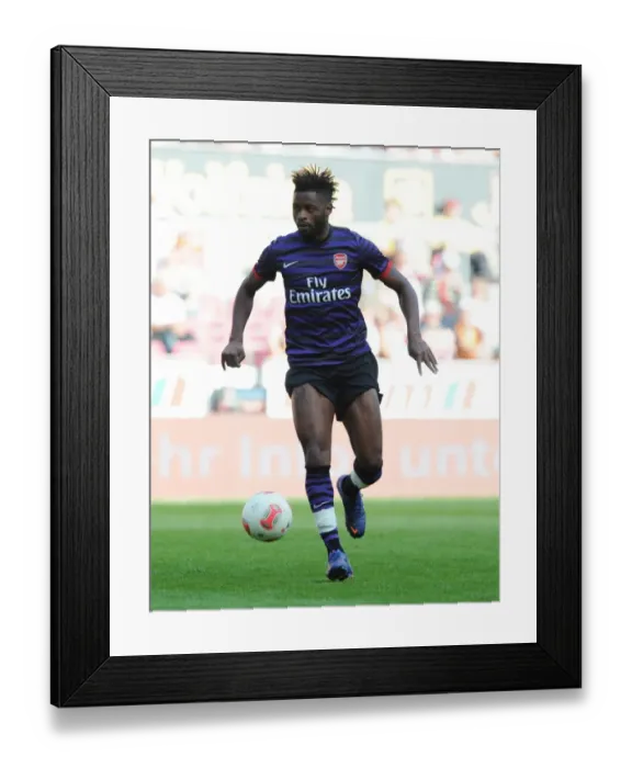 Framed Print : Alex Song in Action: Arsenal vs. FC Cologne, 2012