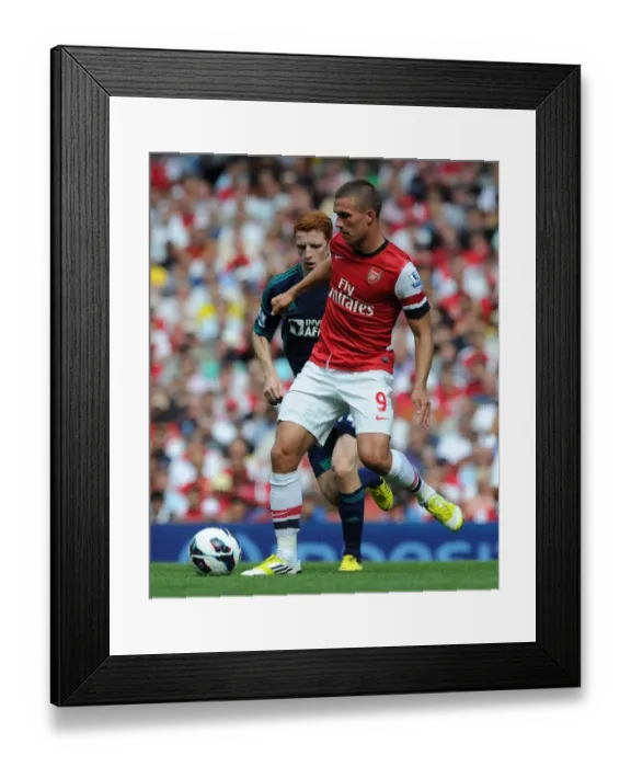 Framed Print : Arsenal's Lukas Podolski in Action against Sunderland (2012-13 Premier League)