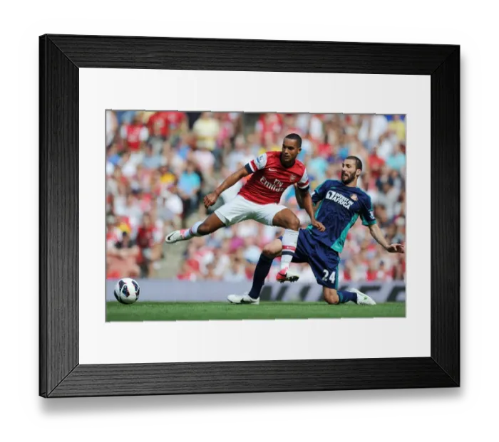 Framed Print : Theo Walcott vs Carlos Cuellar: Intense Battle at Arsenal v Sunderland (2012-13) Framed Print : Theo Walcott vs Carlos Cuellar: Intense Battle at Arsenal v Sunderland (2012-13)