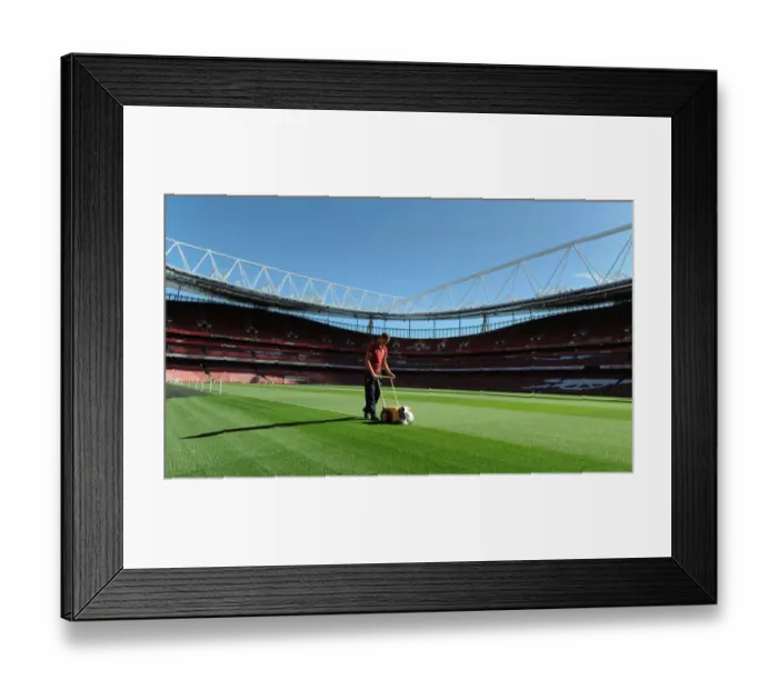 Framed Print : Preparing the Emirates Stadium Turf: Arsenal's Premier League Battle against Sunderland