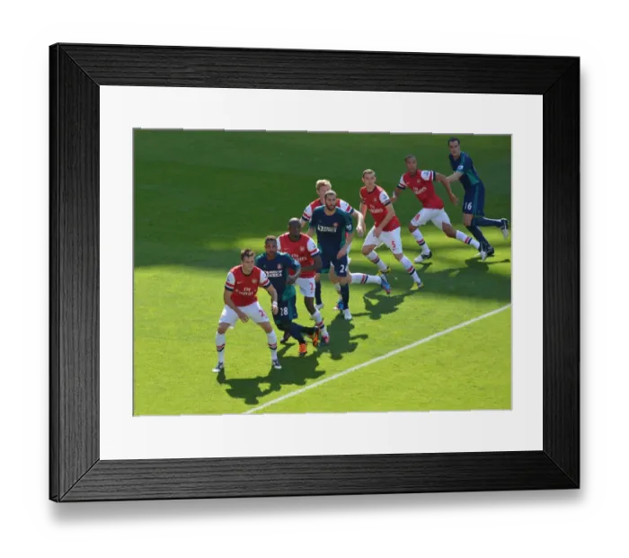 Framed Print : LONDON, ENGLAND - AUGUST 18: Arsenal players prepare to defend a free kick during the Barclays Premier League match between Arsenal and Sunderland at Emirates Stadium on August 18, 2012 in London, England. : Arsenal Football
