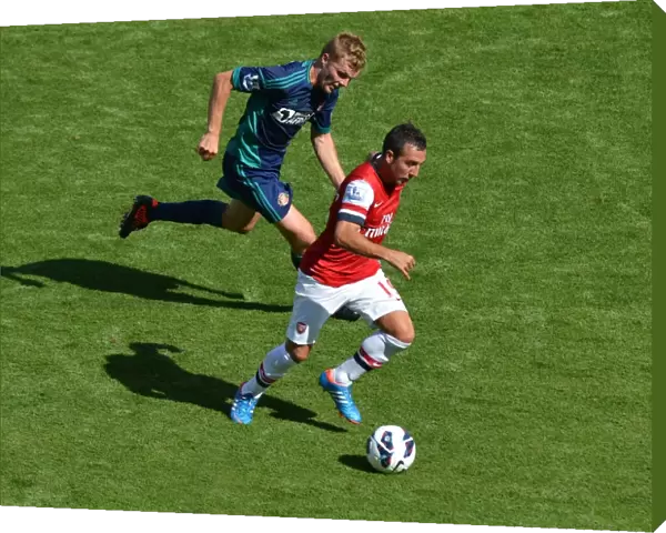 LONDON, ENGLAND - AUGUST 18: Santi Cazorla of Arsenal takes on Seb Larsson of Sunderland during the Barclays Premier League match between Arsenal and Sunderland at Emirates Stadium on August 18, 2012 in London, England. : Arsenal Football