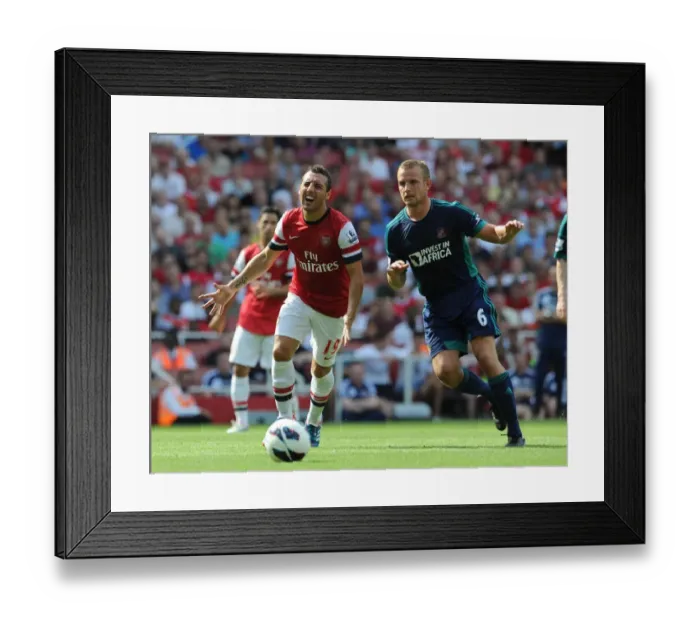 Framed Print : Arsenal's Santi Cazorla Faces Off Against Sunderland's Lee Catermole in Premier League Clash Framed Print : Arsenal's Santi Cazorla Faces Off Against Sunderland's Lee Catermole in Premier League Clash