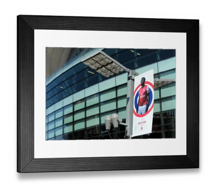 Framed Print : Bacary Sagna banner outside the stadium. Arsenal 0: 0 Sunderland. Barclays Premier League