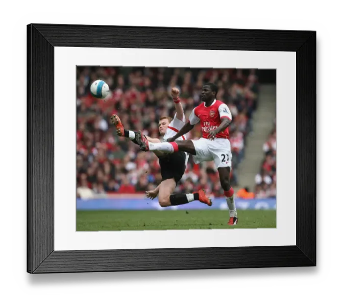 Framed Print : Emmanuel Eboue (Arsenal) John Arne Riise (Liverpool)
