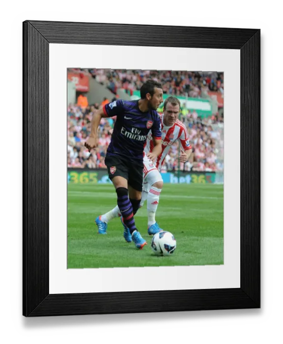 Framed Print : Santi Cazorla Outmaneuvers Glenn Whelan: A Moment from the Stoke City vs. Arsenal Premier League Clash (2012-13) Framed Print : Santi Cazorla Outmaneuvers Glenn Whelan: A Moment from the Stoke City vs. Arsenal Premier League Clash (2012-13)