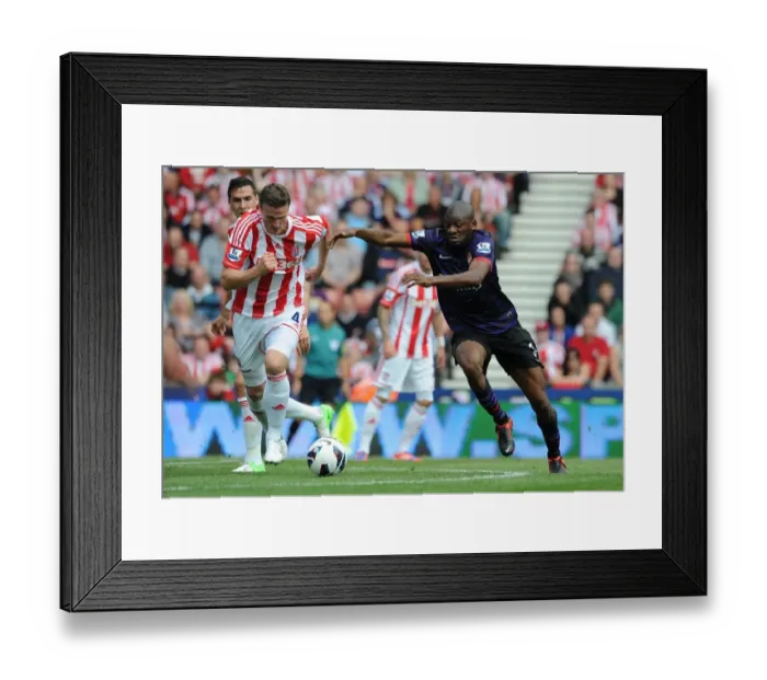 Framed Print : Abou Diaby Outmaneuvers Robert Huth: A Battle in the Premier League Match Between Stoke City and Arsenal (2012-13) Framed Print : Abou Diaby Outmaneuvers Robert Huth: A Battle in the Premier League Match Between Stoke City and Arsenal (2012-13)