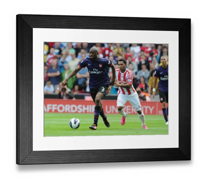 Framed Print : Abou Diaby Outmaneuvers Jermaine Pennant: A Premier League Clash at Britannia Stadium, 2012 Framed Print : Abou Diaby Outmaneuvers Jermaine Pennant: A Premier League Clash at Britannia Stadium, 2012