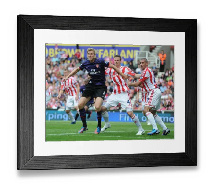Framed Print : Clash of Titans: Per Mertesacker vs. Robert Huth & Jonathan Walters (Stoke City vs. Arsenal, 2012-13) Framed Print : Clash of Titans: Per Mertesacker vs. Robert Huth & Jonathan Walters (Stoke City vs. Arsenal, 2012-13)