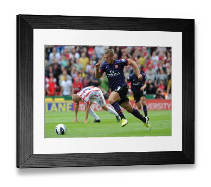 Framed Print : Lukas Podolski in Action: Stoke City vs. Arsenal, Premier League 2012-13