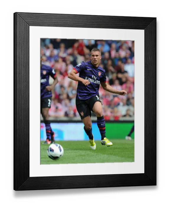 Framed Print : Lukas Podolski: Starring in Arsenal's Battle Against Stoke City, Premier League 2012-13