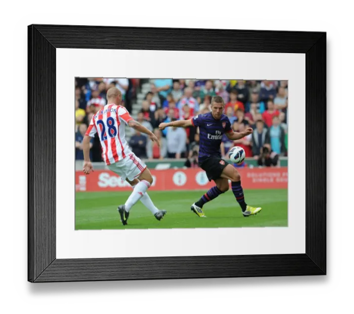 Framed Print : Podolski vs. Wilkinson: Battle at Britannia Stadium - Stoke City vs. Arsenal, 2012-13 Premier League