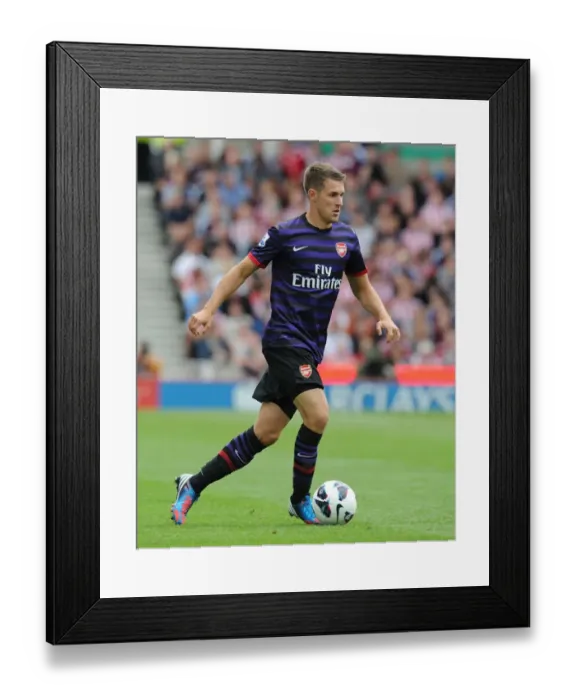 Framed Print : Aaron Ramsey in Action: Stoke City vs. Arsenal, Premier League 2012-13 Framed Print : Aaron Ramsey in Action: Stoke City vs. Arsenal, Premier League 2012-13