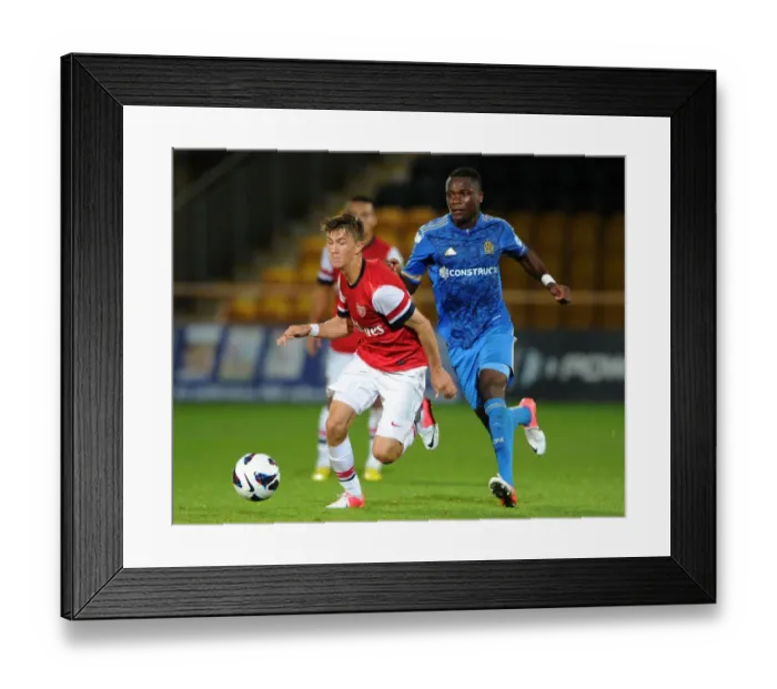 Framed Print : Arsenal's Olsson Outpaces Marseille's Anani in NextGen Series Clash Framed Print : Arsenal's Olsson Outpaces Marseille's Anani in NextGen Series Clash