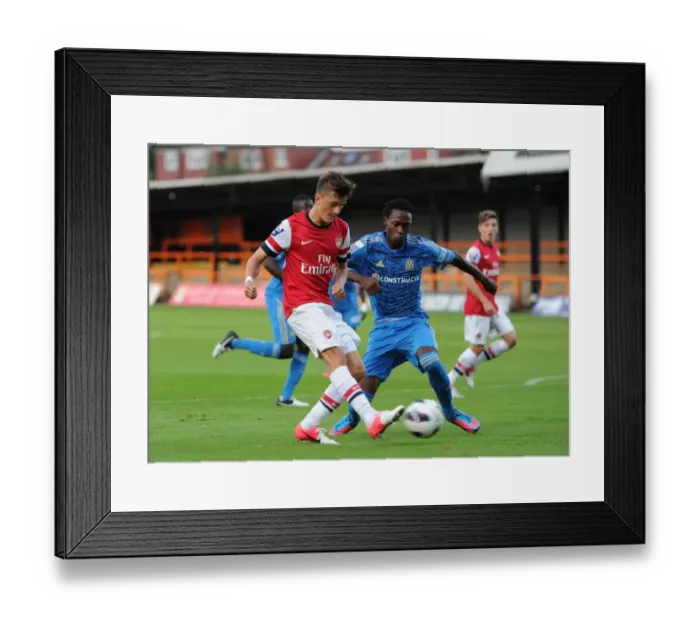Framed Print : Arsenal's Olsson Faces Off Against Marseille's Charles in NextGen Series Clash Framed Print : Arsenal's Olsson Faces Off Against Marseille's Charles in NextGen Series Clash