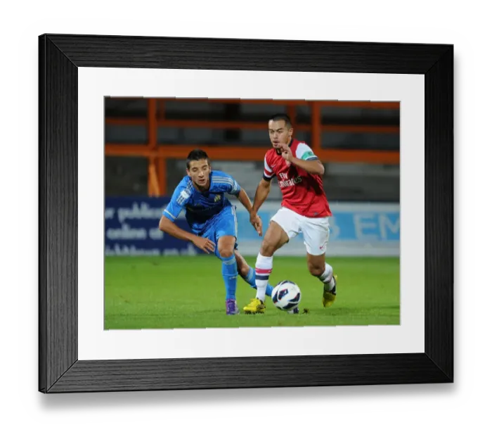 Framed Print : Arsenal's Nico Yennaris Clashes with Marseille's Kevin Pommier in NextGen Series