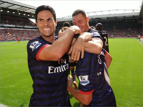 Arsenal's Unforgettable Goal: Mikel Arteta and Santi Cazorla Celebrate at Anfield (2012-13)