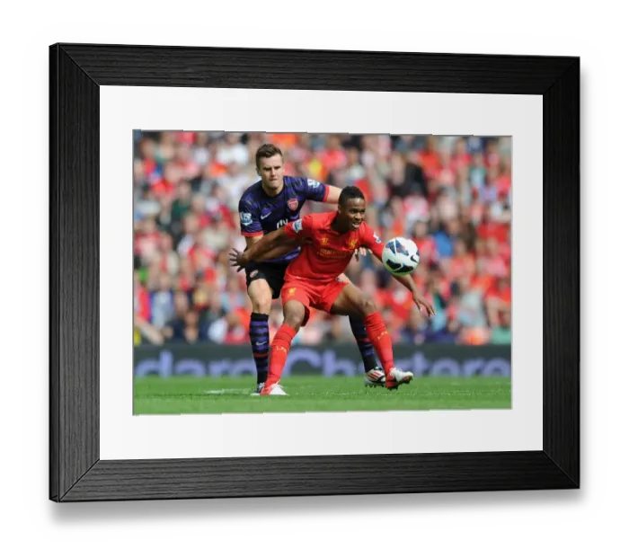 Framed Print : Clash of Young Stars: Jenkinson vs. Sterling - Premier League Battle at Anfield (2012-13) Framed Print : Clash of Young Stars: Jenkinson vs. Sterling - Premier League Battle at Anfield (2012-13)