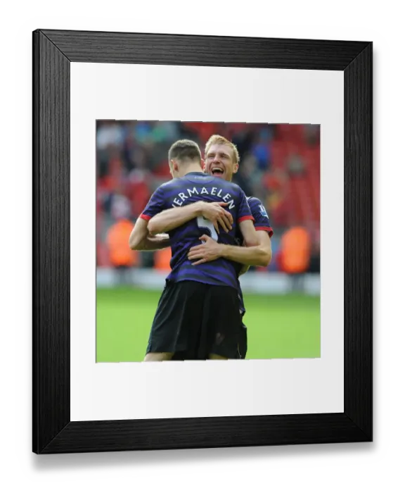 Framed Print : Arsenal's Unforgettable Victory: Vermaelen and Mertesacker's Emotional Celebration at Anfield, 2012-13 Premier League