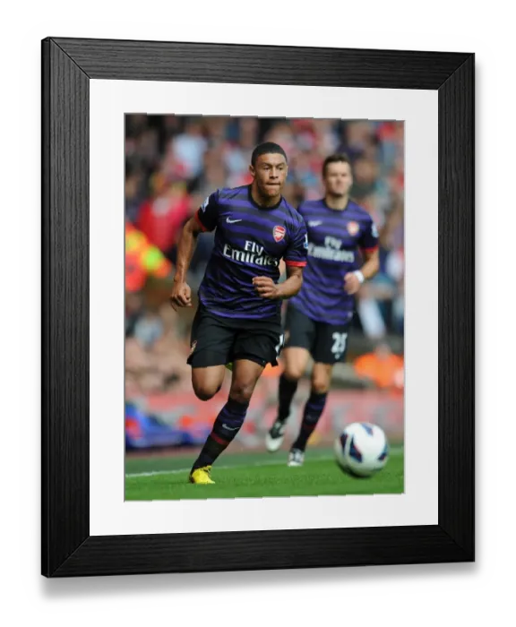 Framed Print : Alex Oxlade-Chamberlain Faces Liverpool: Premier League Showdown 2012-13 Framed Print : Alex Oxlade-Chamberlain Faces Liverpool: Premier League Showdown 2012-13