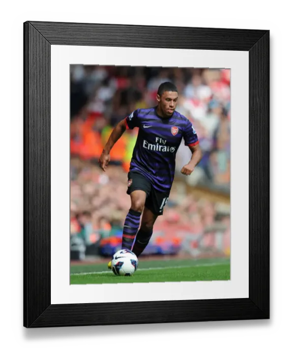 Framed Print : Alex Oxlade-Chamberlain Faces Off at Anfield: Liverpool vs Arsenal (2012-13)