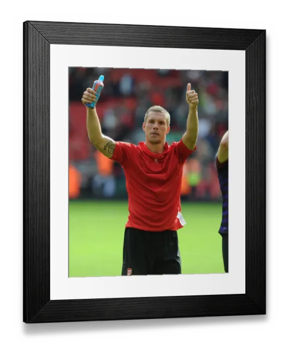 Framed Print : Lukas Podolski's Triumphant Salute: Liverpool vs. Arsenal, Premier League 2012-13 Framed Print : Lukas Podolski's Triumphant Salute: Liverpool vs. Arsenal, Premier League 2012-13