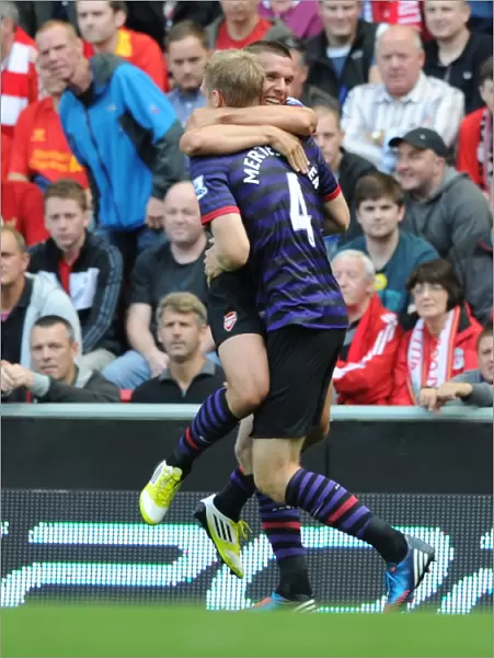 Lukas Podolski and Per Mertesacker Celebrate Arsenal's First Goal Against Liverpool (2012-13)