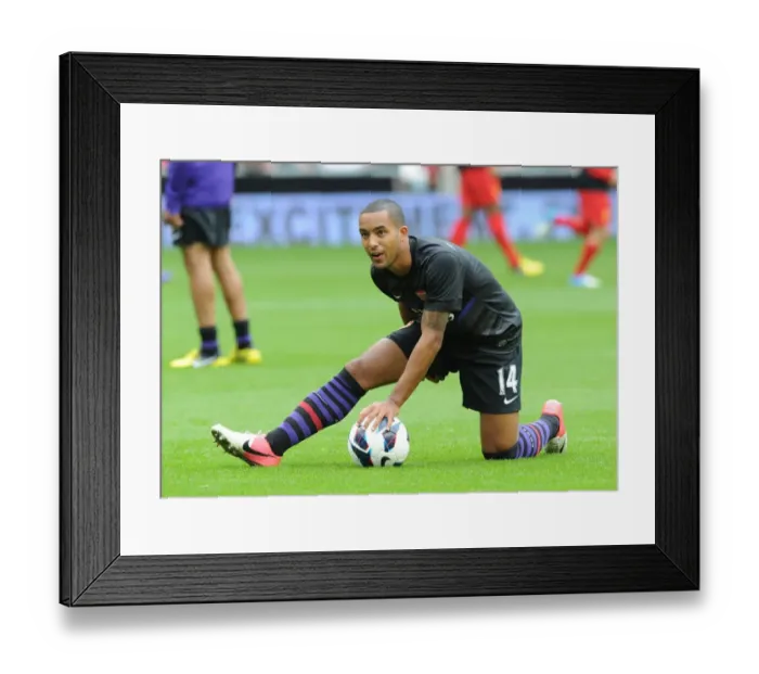 Framed Print : Theo Walcott's Determined Look Before the Liverpool vs Arsenal Premier League Clash (2012-13)