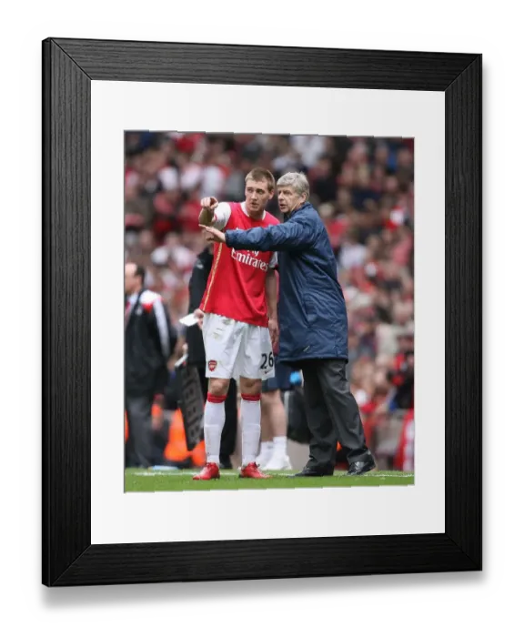 Framed Print : Arsenal manager Arsene Wenger with Nicklas Bendtner during the match Framed Print : Arsenal manager Arsene Wenger with Nicklas Bendtner during the match