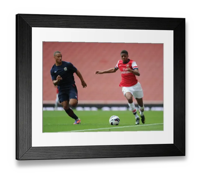 Framed Print : Exclusive: Chuba Akpom Breaks Past Blackburn's Henley in Arsenal U21 Clash