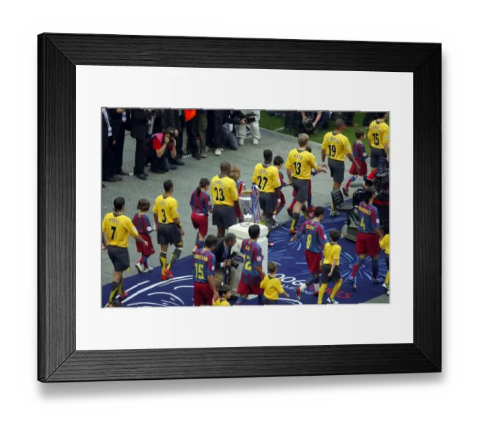 Framed Print : The Arsenal and Barcelona teams walk out past the European Cup