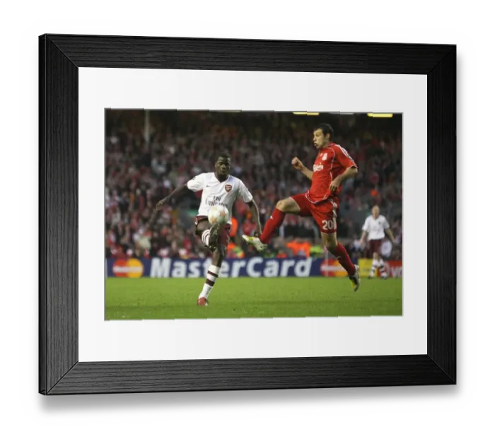 Framed Print : Clash of Titans: Eboue vs Mascherano in the Intense Liverpool vs Arsenal UEFA Champions League Quarterfinal (4:2 in favor of Liverpool)