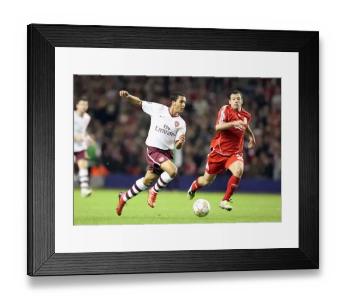 Framed Print : Theo Walcott's Game-Changing Moment: Beating Mascherano to Set Up Adebayor's Goal in Arsenal's UEFA Champions League Battle at Anfield