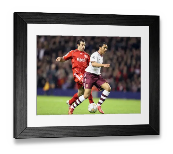Framed Print : Theo Walcott's Game-Changer: Outmaneuvering Mascherano to Set Up Adebayor's Goal in Arsenal's UEFA Champions League Showdown at Anfield, 2008 Framed Print : Theo Walcott's Game-Changer: Outmaneuvering Mascherano to Set Up Adebayor's Goal in Arsenal's UEFA Champions League Showdown at Anfield, 2008